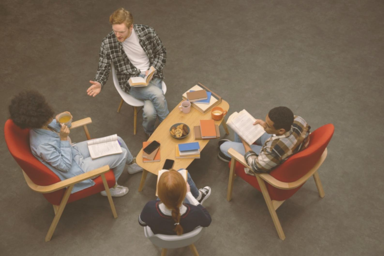 Corporate finance training session with analysts reviewing valuation models
